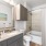 a bathroom with a mirror and shower