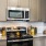 a kitchen with wood cabinets
