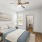a bedroom with a bed and lamps